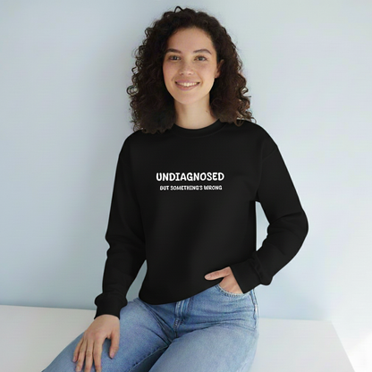 Unisex Black Graphic Sweatshirt – “Undiagnosed But Something’s Wrong” – Crewneck, Long Sleeve, Cotton‑Blend Fleece (S–XL)
