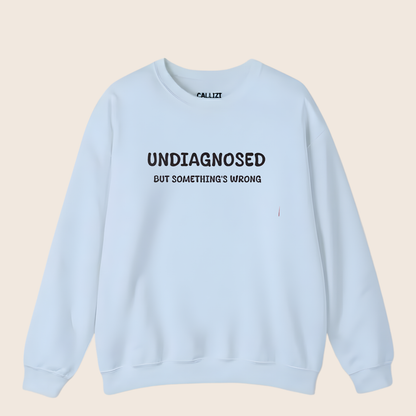 Unisex Black Graphic Sweatshirt – “Undiagnosed But Something’s Wrong” – Crewneck, Long Sleeve, Cotton‑Blend Fleece (S–XL)