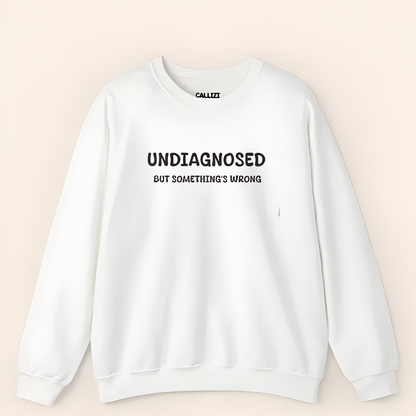 Unisex Black Graphic Sweatshirt – “Undiagnosed But Something’s Wrong” – Crewneck, Long Sleeve, Cotton‑Blend Fleece (S–XL)