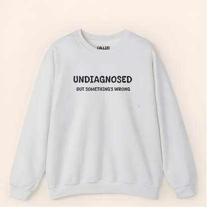 Unisex Black Graphic Sweatshirt – “Undiagnosed But Something’s Wrong” – Crewneck, Long Sleeve, Cotton‑Blend Fleece (S–XL)