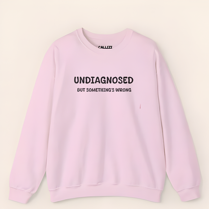 Unisex Black Graphic Sweatshirt – “Undiagnosed But Something’s Wrong” – Crewneck, Long Sleeve, Cotton‑Blend Fleece (S–XL)