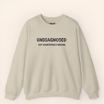 Unisex Black Graphic Sweatshirt – “Undiagnosed But Something’s Wrong” – Crewneck, Long Sleeve, Cotton‑Blend Fleece (S–XL)