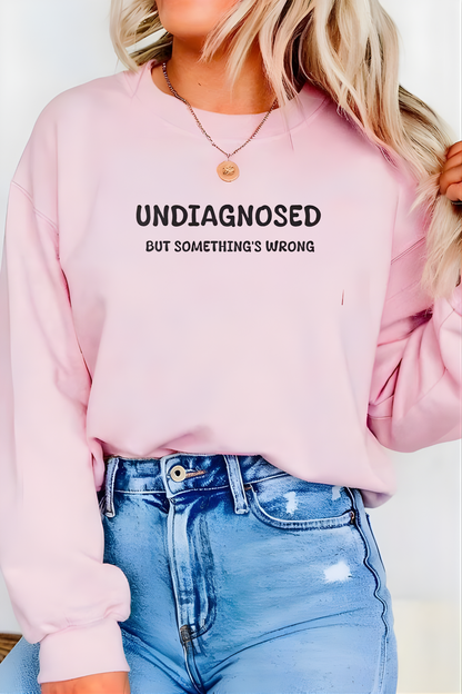 Unisex Black Graphic Sweatshirt – “Undiagnosed But Something’s Wrong” – Crewneck, Long Sleeve, Cotton‑Blend Fleece (S–XL)