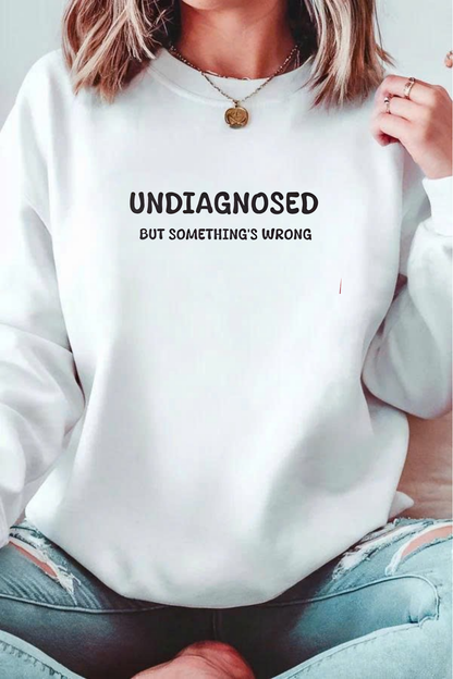 Unisex Black Graphic Sweatshirt – “Undiagnosed But Something’s Wrong” – Crewneck, Long Sleeve, Cotton‑Blend Fleece (S–XL)